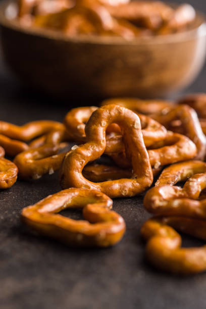 istock Heart shaped pretzel on black table. 2202266602