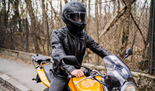 istock Man with helmet on a motorcycle 2202266675