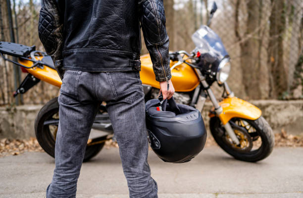 istock Motorcyclist man holding his helmet 2202266890