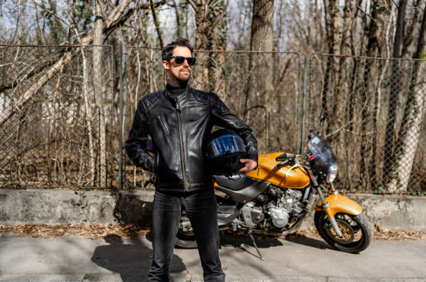 istock Young motorcyclist in a leather jacket 2202266979