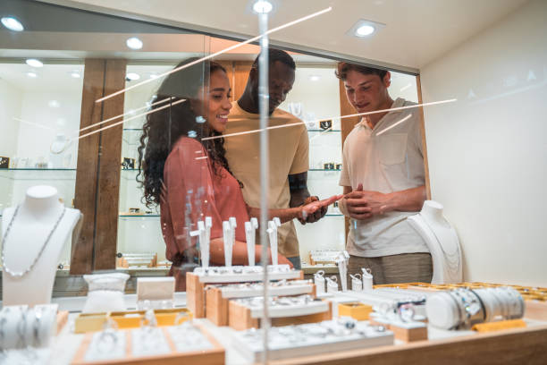 istock Diverse Couple Choosing Jewelry 2202277553