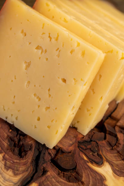 istock hard cheese with holes on the cutting board 2202282077