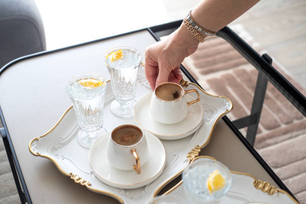 istock Close up women hand serving traditional Turkish coffee drink 2202289064