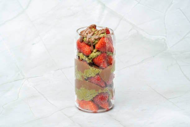 istock Dubai chocolate strawberry cup with kataifi, pistachio paste, milk chocolate and fresh strawberries. Copy space for text. Sweets and desserts. Street food. 2202292709