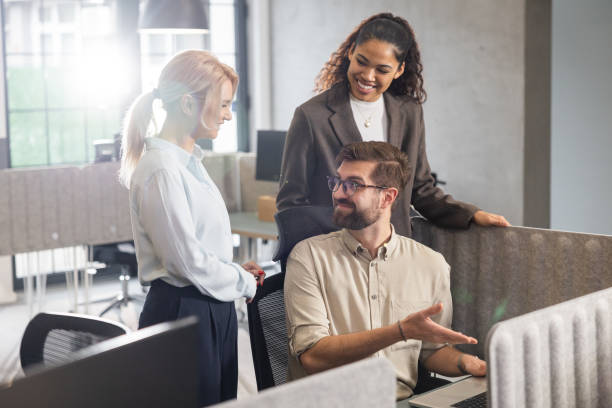 istock Man introduces young female colleagues with job 2202295604