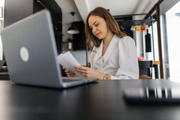 istock Woman working on her laptop at home 2202295918