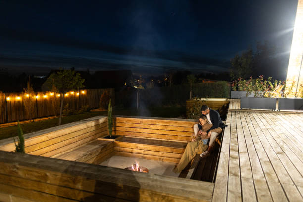 istock Couple having romantic evening in front of a firepit 2202297107