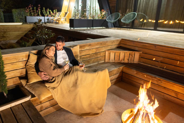 istock Couple having romantic evening in front of a firepit 2202297210