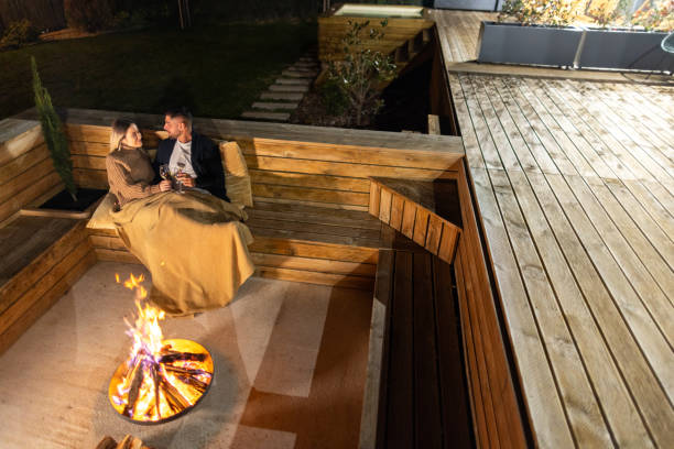 istock Couple having romantic evening in front of a firepit 2202297214