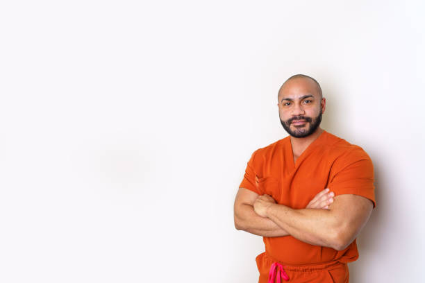 istock Confident male nurse posing with arms crossed on white background 2202298009