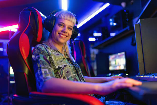 istock Professional female gamer playing video game on computer 2202299285