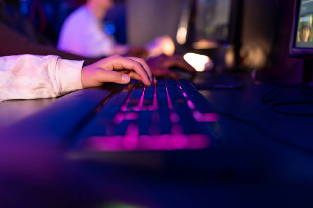 istock Professional Gamer Playing on a Powerful Computer in a Dark Room 2202299369