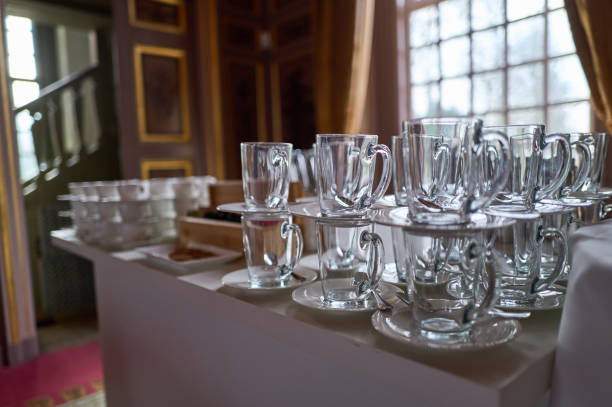 istock Empty glass cups and saucers ready for coffee break in luxurious setting 2202300113