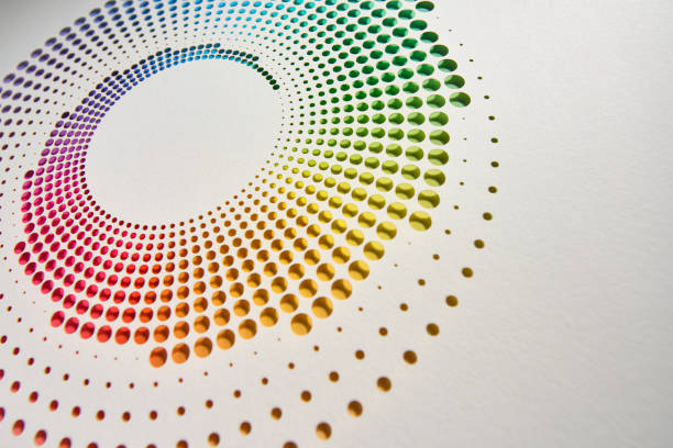 istock Abstract cut paper artwork with circular perforations forming a vibrant rainbow gradient on a white background. 2202303679