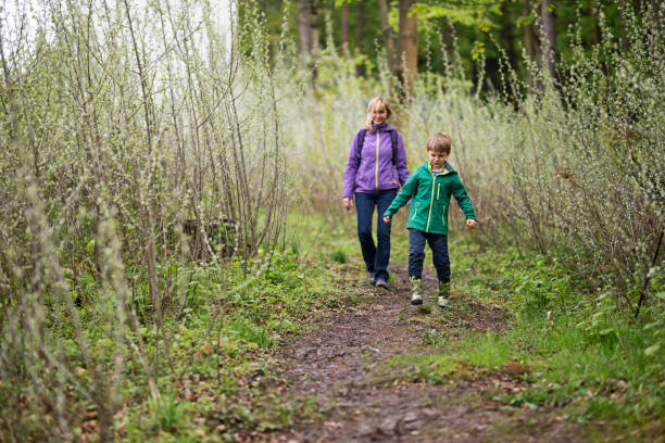 istock Mother and son exploring a vibrant spring forest path in Bieszczady Mountains 2202304579