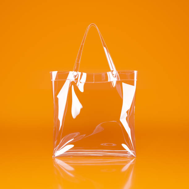 istock Transparent bag with white handles on an orange background. 2202315420