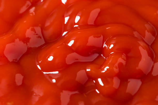 Red tomato sauce ketchup stains and smears.