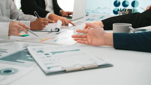 istock Business team collaboration in office with charts, graphs, and documents during meeting on planning and strategy development for project success SACTR 2202317203