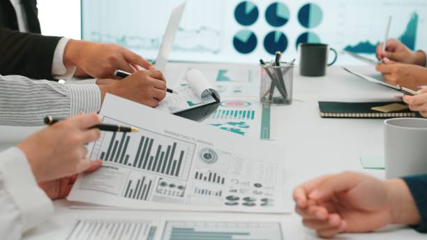 istock Business Team Collaborating on Data Analysis and Strategic Planning During a Meeting with Graphs and Charts on Display SACTR 2202317289