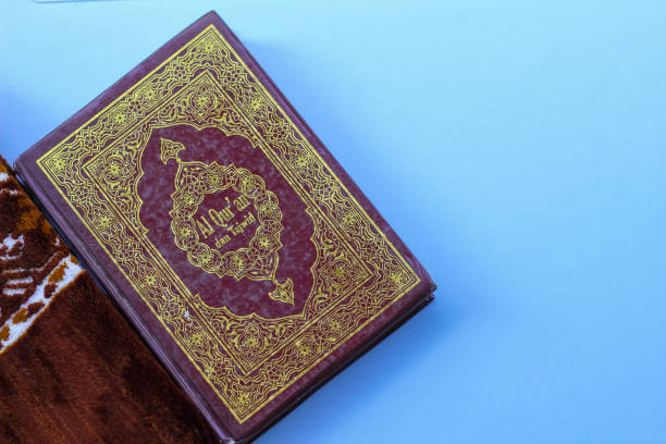 Al Quran Arabic isolated blue background, Ramadan concept