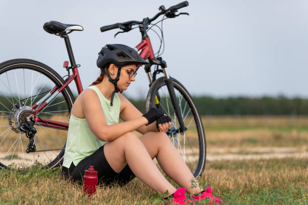 istock Female cyclist resting and checking smartwatch 2202319655