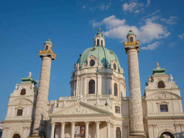 Vienna, Austria - 31 July 2023: Karlskirche church on Karlsplatz square at sunset. Vienna capital of a Europe country Austria. Discovering Vienna in summer architecture and culture,