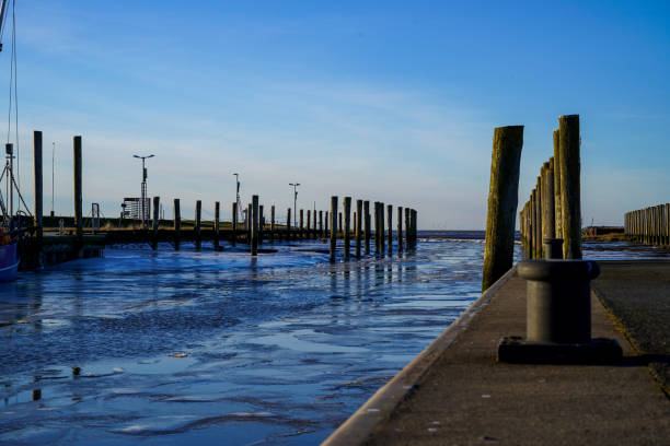 Winter evening atmosphere and no boat to be seen. Boat dock in Dorum harbor, Cuxhaven-Germany.