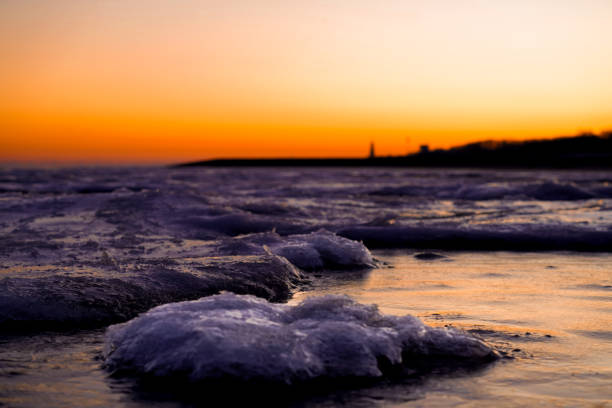 The view over the frozen Wadden Sea. Sunrise at low tide and around 6 degrees Celsius on the North Sea coast near Cuxhaven-Germany
