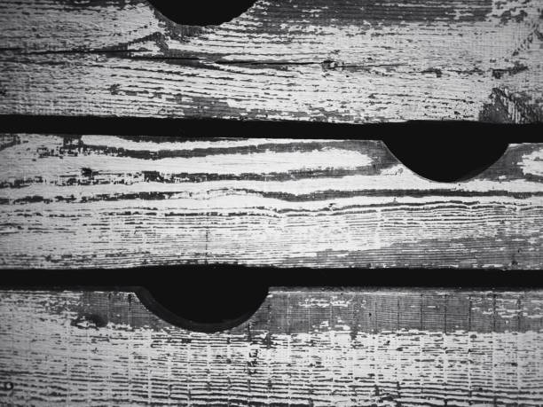 Wooden texture with scratches and cracks. Old painted wood wall - texture or background. Black and white. Old wooden boards as a background.