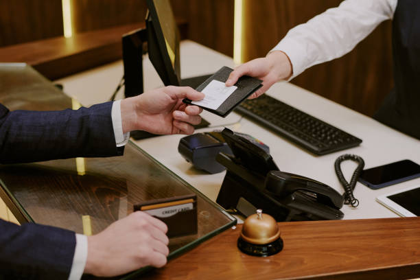 istock Room Key and Passport in Hands 2202327530