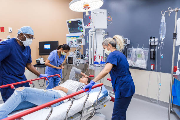istock Emergency Room: Diverse Medical Team Assisting Patient on Stretcher 2202327874