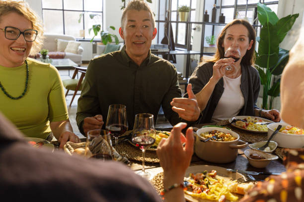 istock Joyful Dinner Party with Friends - Togetherness, Laughter & Gourmet Dining 2202328149