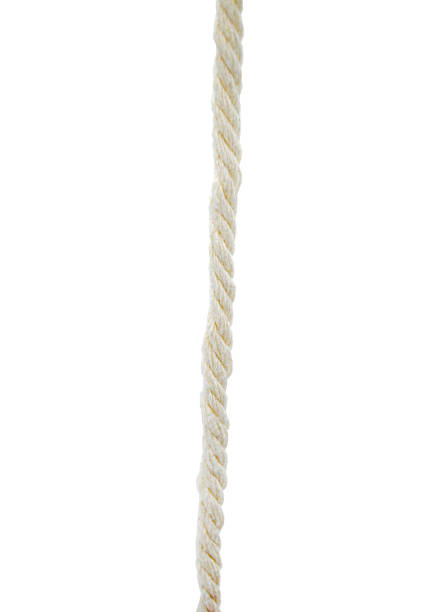 istock Twisted natural fiber rope hanging vertically against a plain background 2202329170
