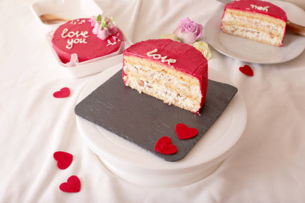 istock Romantic pink valentine's cake with love message and heart decorations 2202329257