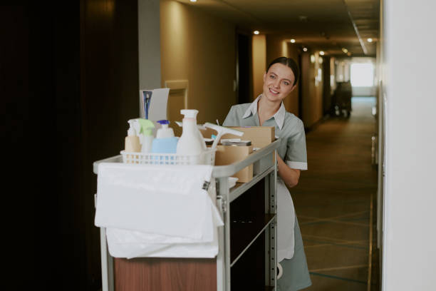 istock Chambermaid with Cart in Hotel Hall 2202330305