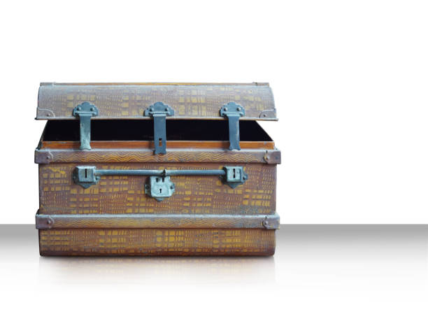 The keyhole is on an old closed suitcase. Retro-style. Travels background.