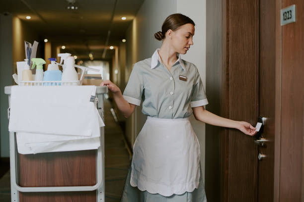 istock Hotel Worker Opening Room with Key Card 2202330707