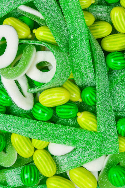 Fluffy candy on green and soft balloon surface.