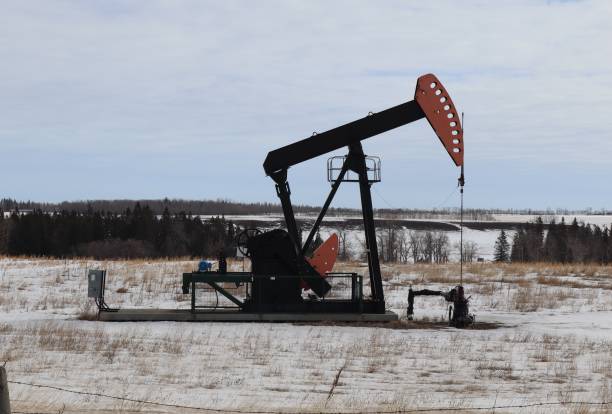 istock A pumpjack, pumping oil, in winter. 2202337523