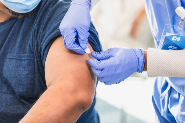 istock Healthcare Worker Applying Bandage After Vaccination 2202340993