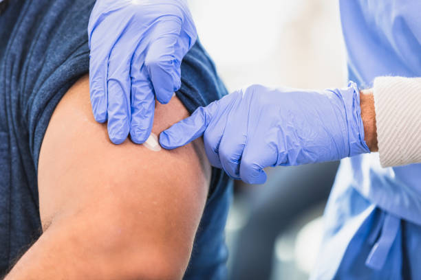 istock Healthcare Worker Applying Bandage After Vaccination 2202340994