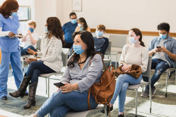 Diverse Group of People Waiting Patiently in a Doctor's Office