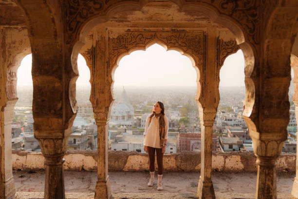 istock Woman looking at Jaipur cityscape at sunset 2202346556