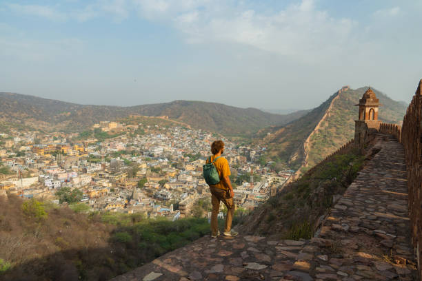istock Man walking on surrounding wall in Amber, Jaipur looking at view 2202348040