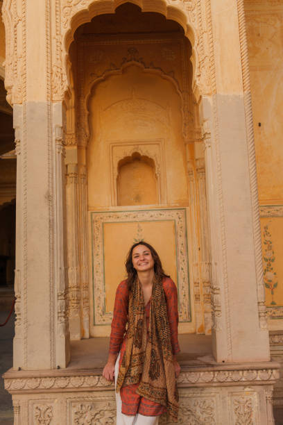 istock Woman exploring architecture during trip in Jaipur, India 2202348532