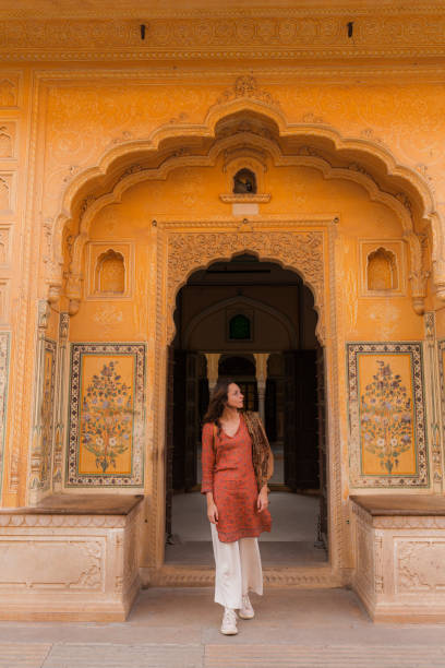 istock Woman exploring architecture during trip in Jaipur, India 2202348763