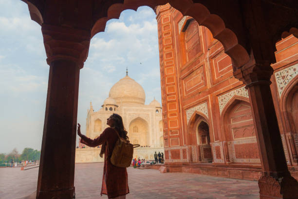 istock Woman exploring Taj Mahal at sunrise, India 2202348872