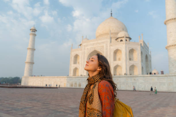 istock Woman exploring Taj Mahal at sunrise, India 2202349028