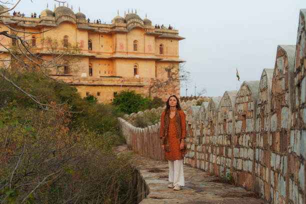 istock Woman exploring architecture during trip in Jaipur, India 2202349165