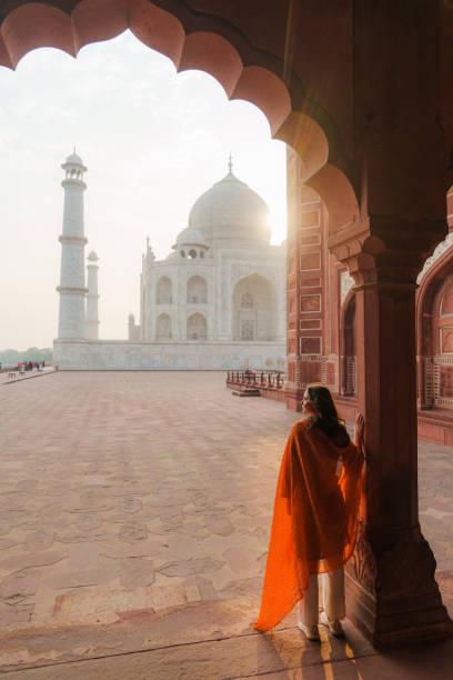 istock Woman exploring Taj Mahal at sunrise, India 2202349389